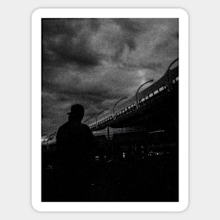 35mm black and white film photo // The man in the cap is standing near the big bridge Sticker